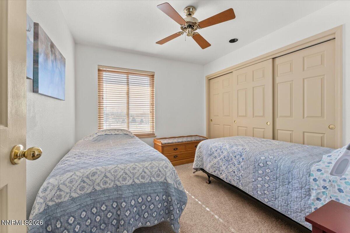 9580 Benedict Drive Sparks, NV 89441 - Photo 25 of 40 a bedroom with double bed and a window