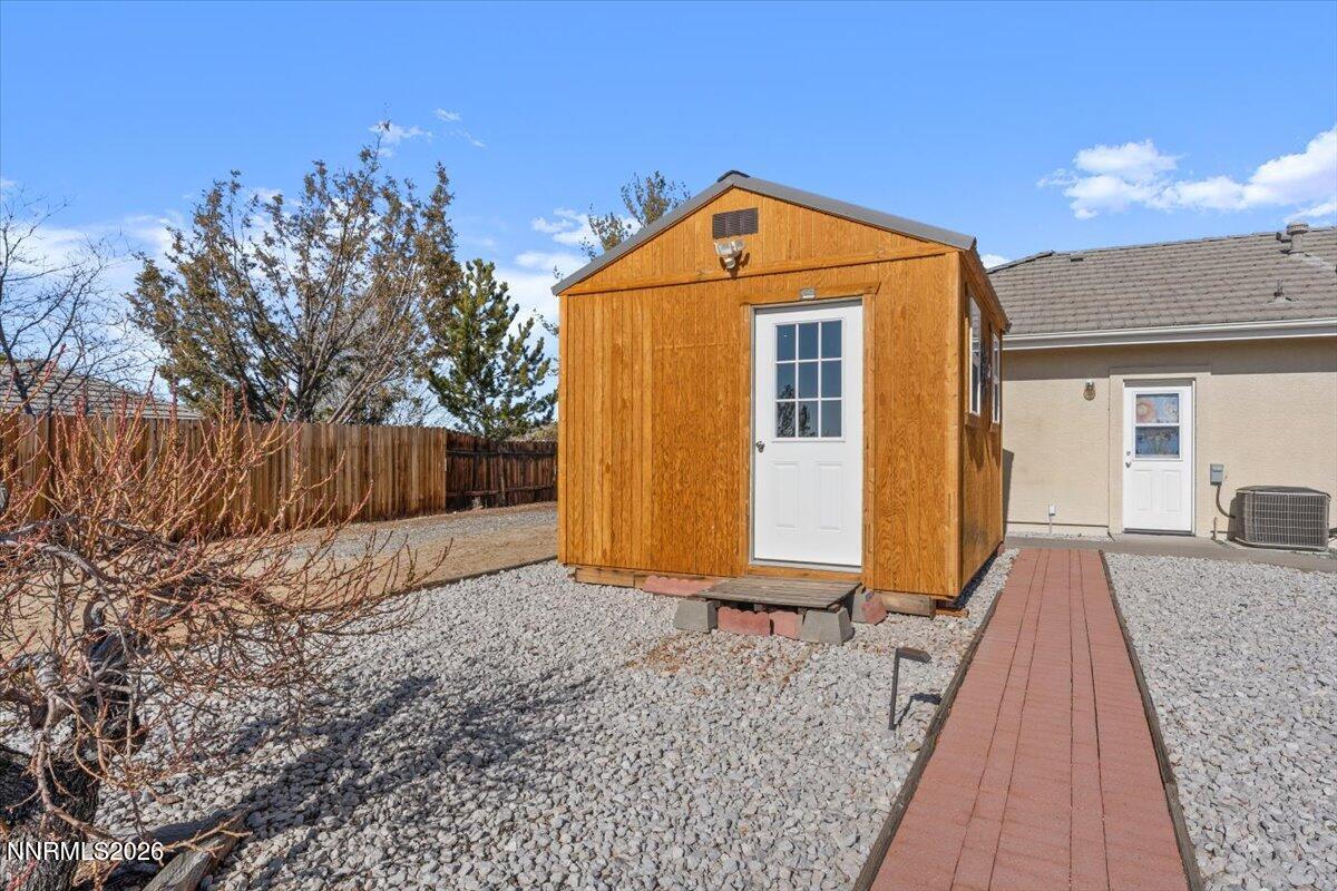 9580 Benedict Drive Sparks, NV 89441 - Photo 30 of 40 a front view of a house with a yard