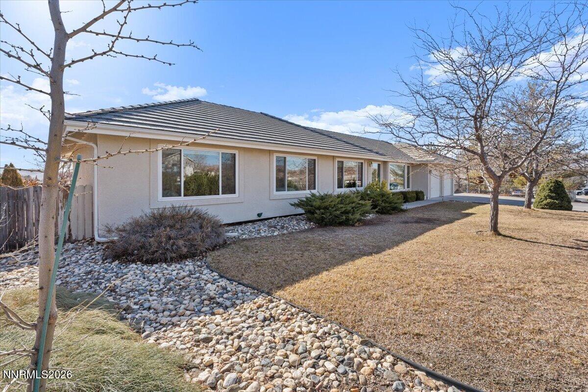 9580 Benedict Drive Sparks, NV 89441 - Photo 4 of 40 a view of a front of a house with a yard