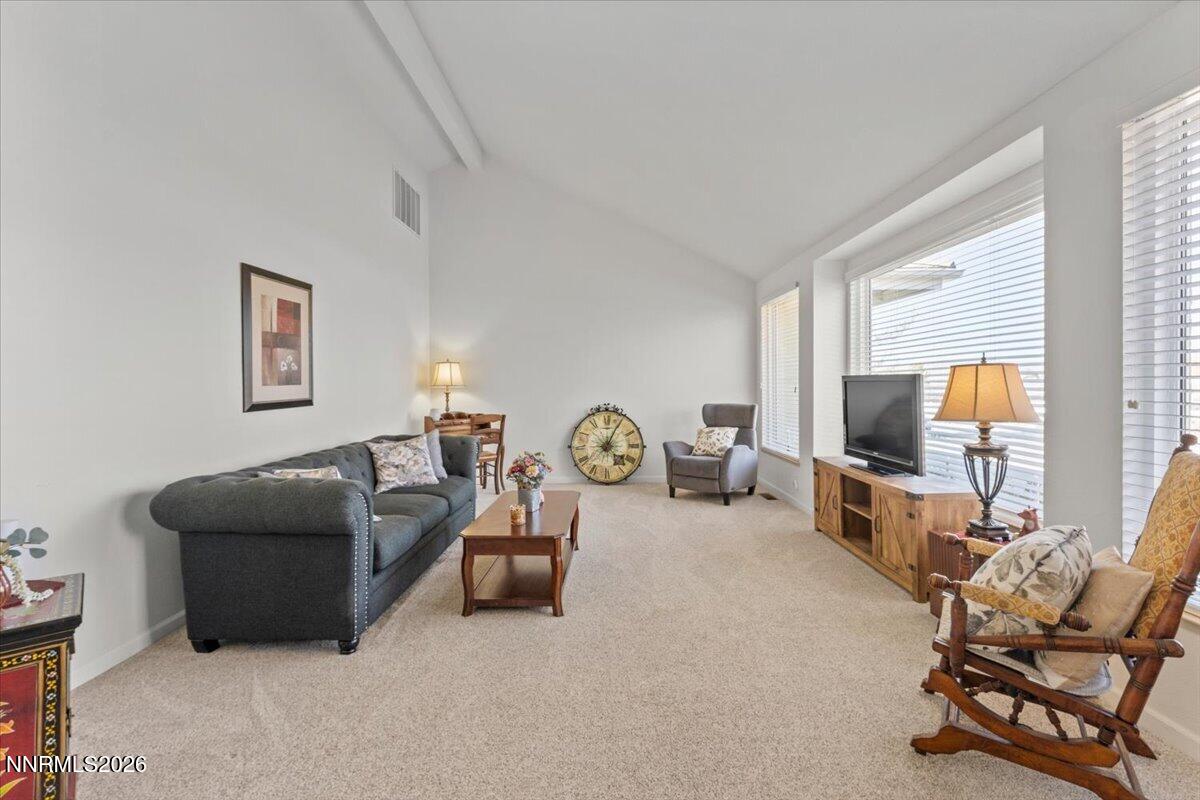 9580 Benedict Drive Sparks, NV 89441 - Photo 7 of 40 a living room with furniture and a flat screen tv
