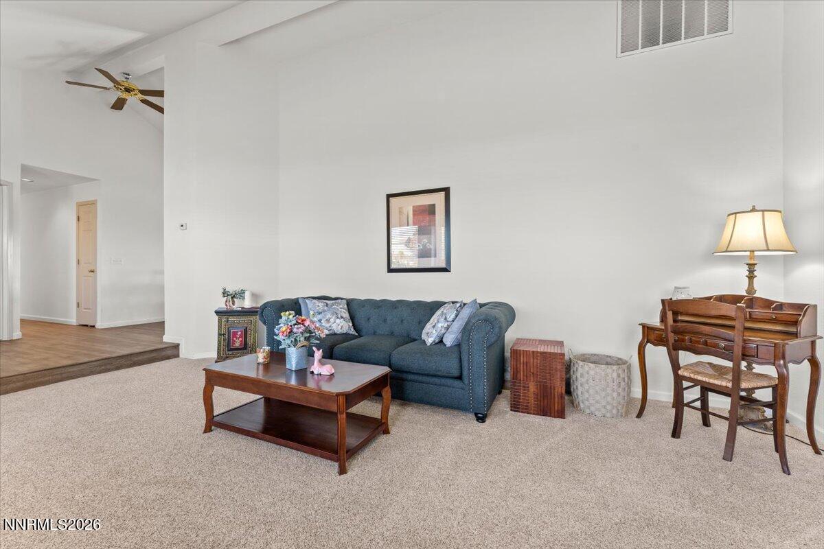 9580 Benedict Drive Sparks, NV 89441 - Photo 8 of 40 a living room with furniture and a lamp