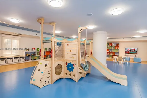 a room with gym equipment and windows