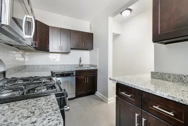 a kitchen with a stove and a sink