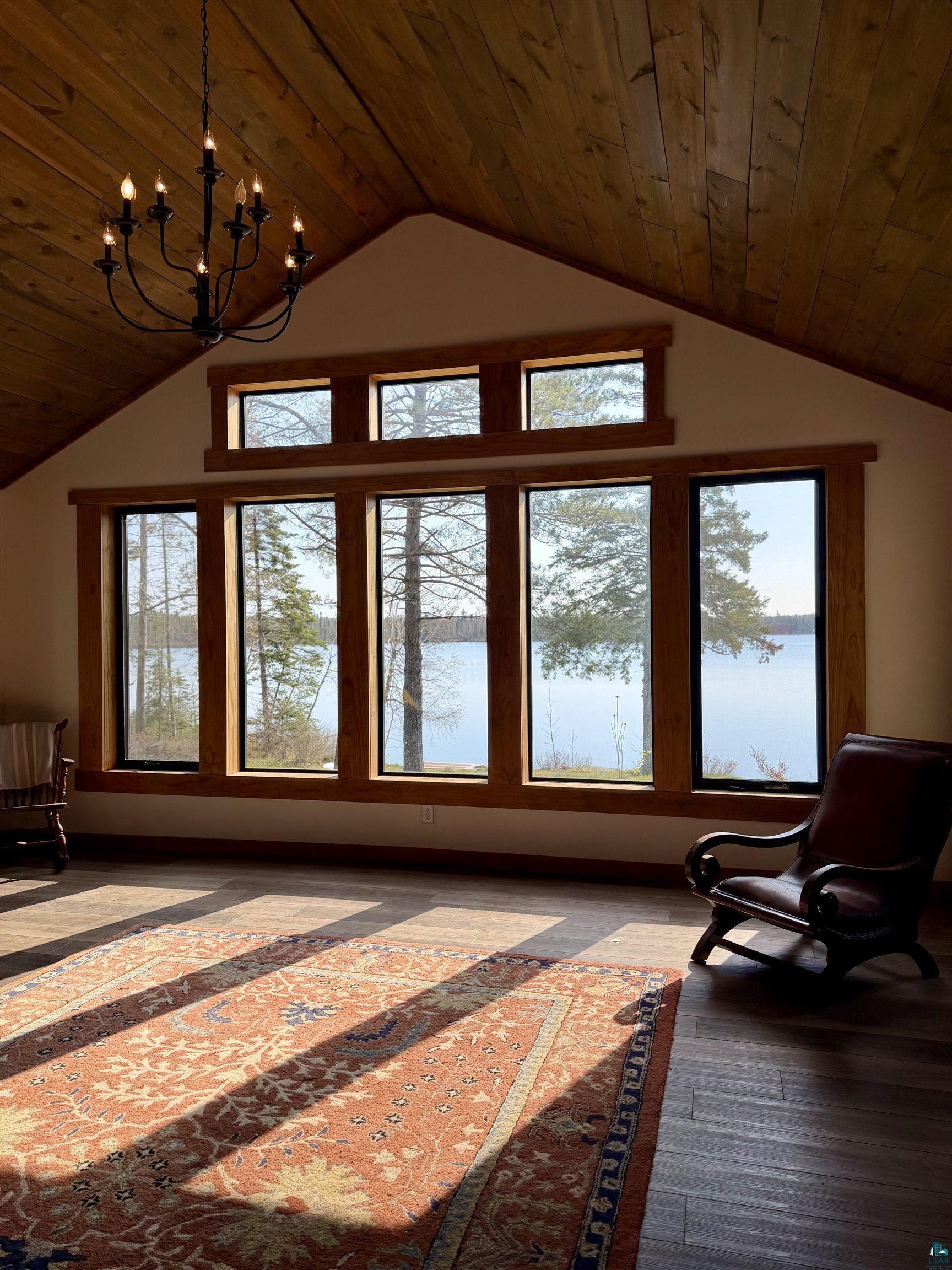 5274 Marble Lake Road Two Harbors, MN 55616 - Photo 7 of 79 Vaulted wood-plank ceiling featuring a black iron chandelier