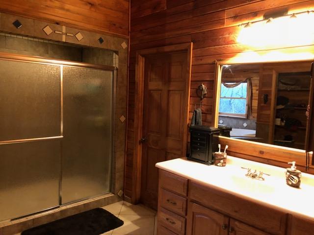 187 Th Hooper Lane McEwen, TN 37101 - Photo 28 of 28 a bathroom with a sink and a mirror