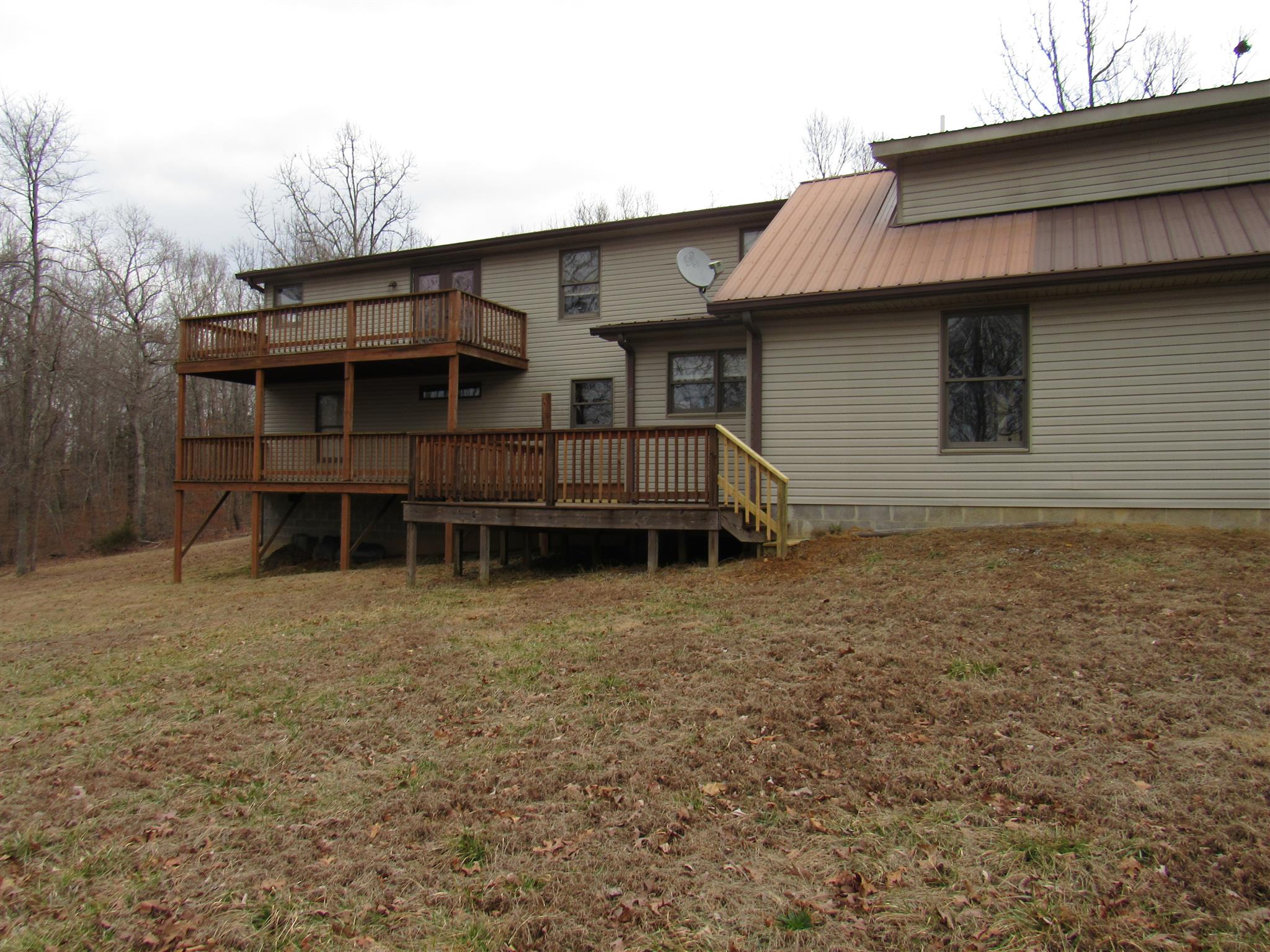 187 Th Hooper Lane McEwen, TN 37101 - Photo 4 of 28 a house with trees in the background