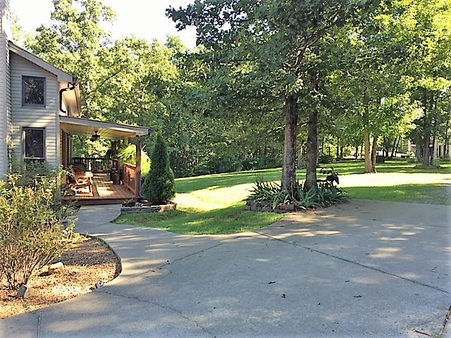 187 Th Hooper Lane McEwen, TN 37101 - Photo 5 of 28 a view of a house with backyard and a tree