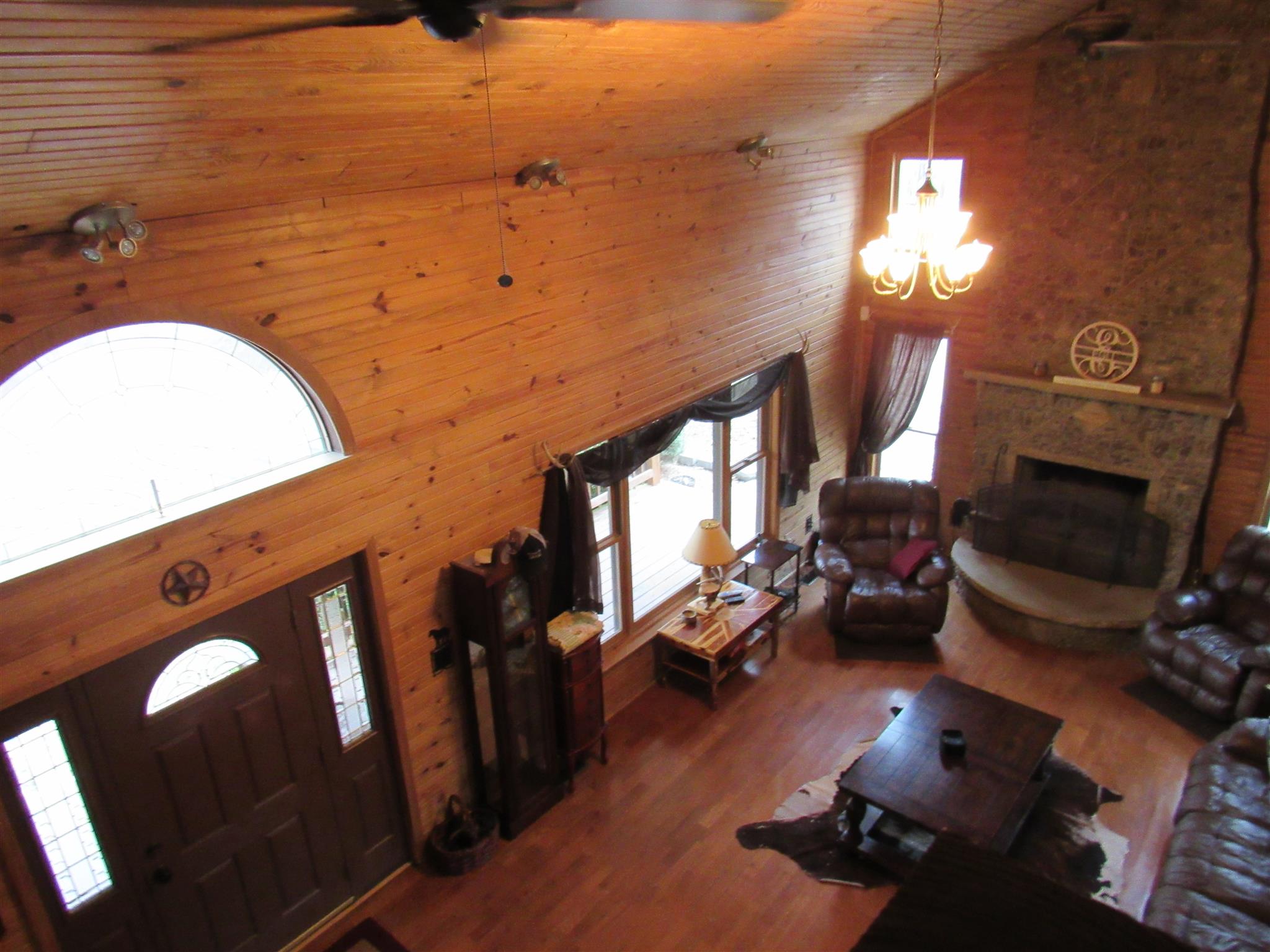 187 Th Hooper Lane McEwen, TN 37101 - Photo 7 of 28 a living room with couches chairs and a fireplace