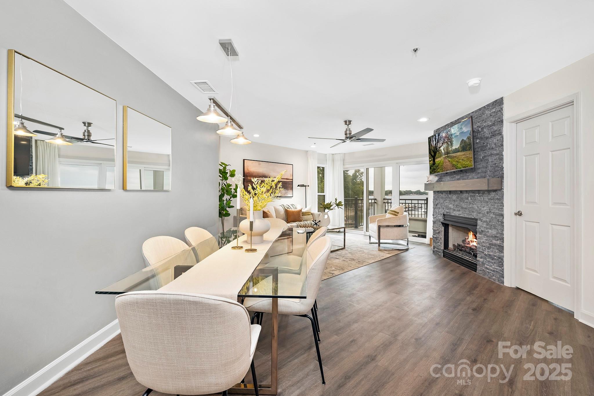 17811 Half Moon Lane, Unit E Cornelius, NC 28031 - Photo 12 of 42 a living room with furniture and a fireplace
