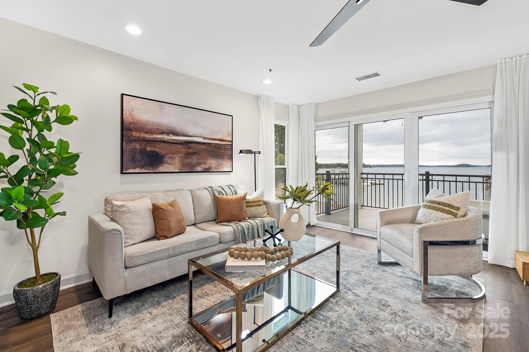 17811 Half Moon Lane, Unit E Cornelius, NC 28031 - Photo 13 of 42 a living room with furniture and a large window with outer view