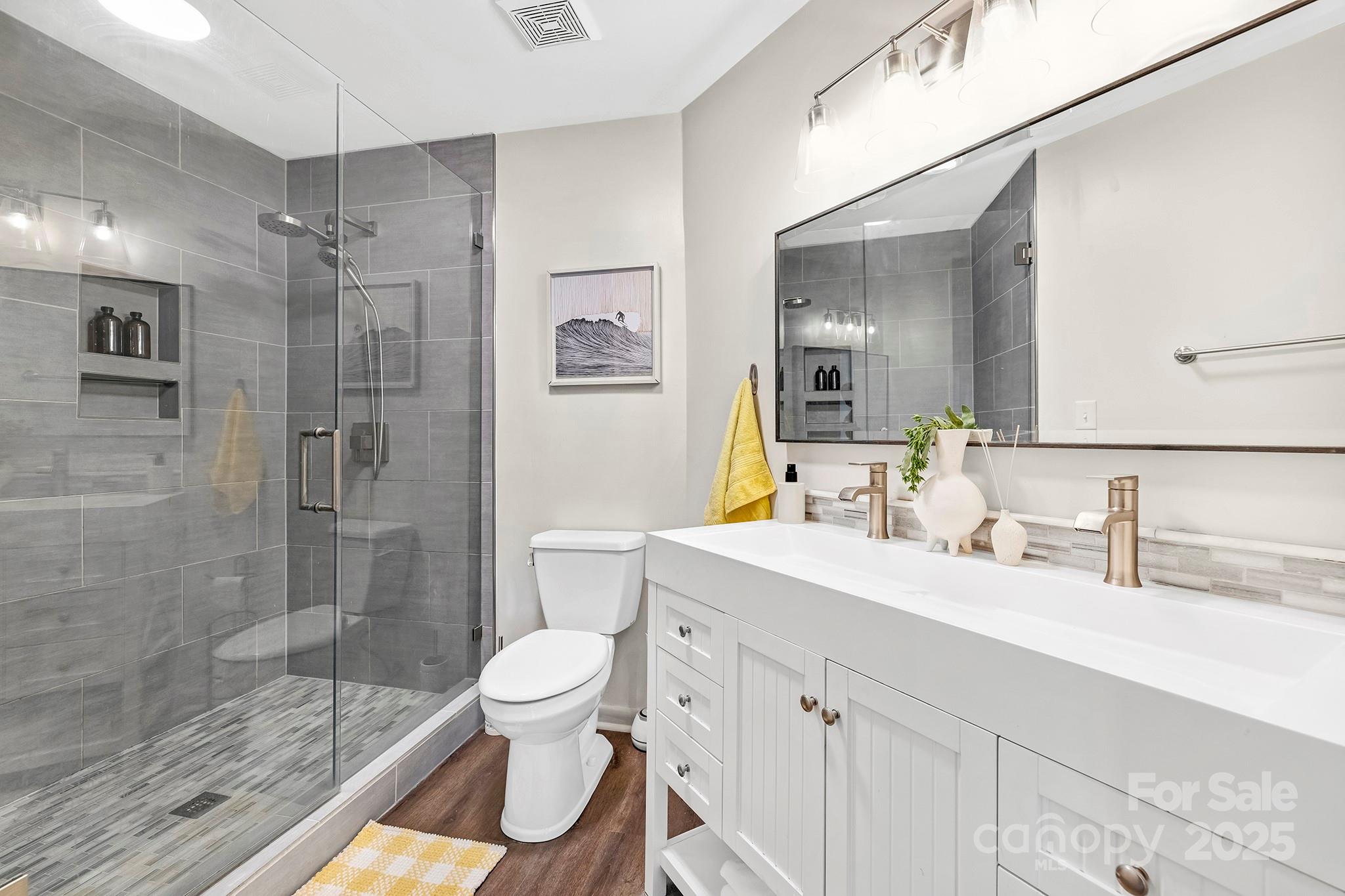 17811 Half Moon Lane, Unit E Cornelius, NC 28031 - Photo 21 of 42 a bathroom with a sink toilet and shower