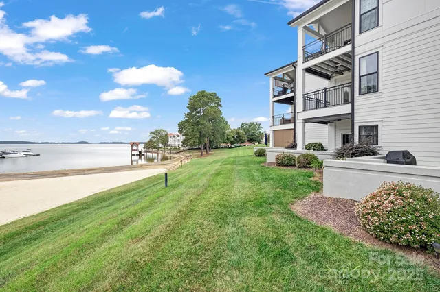 a view of a garden with a building in the background