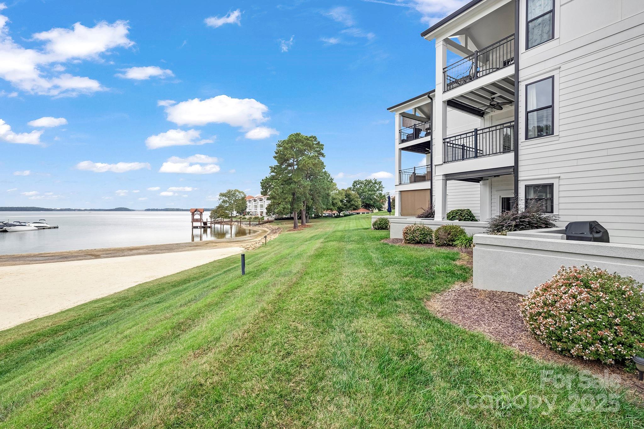 17811 Half Moon Lane, Unit E Cornelius, NC 28031 - Photo 29 of 42 a view of a garden with a building in the background