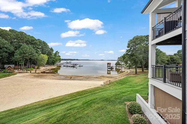 a view of a house with a yard and a garden
