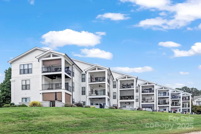 a view of a big building with a yard