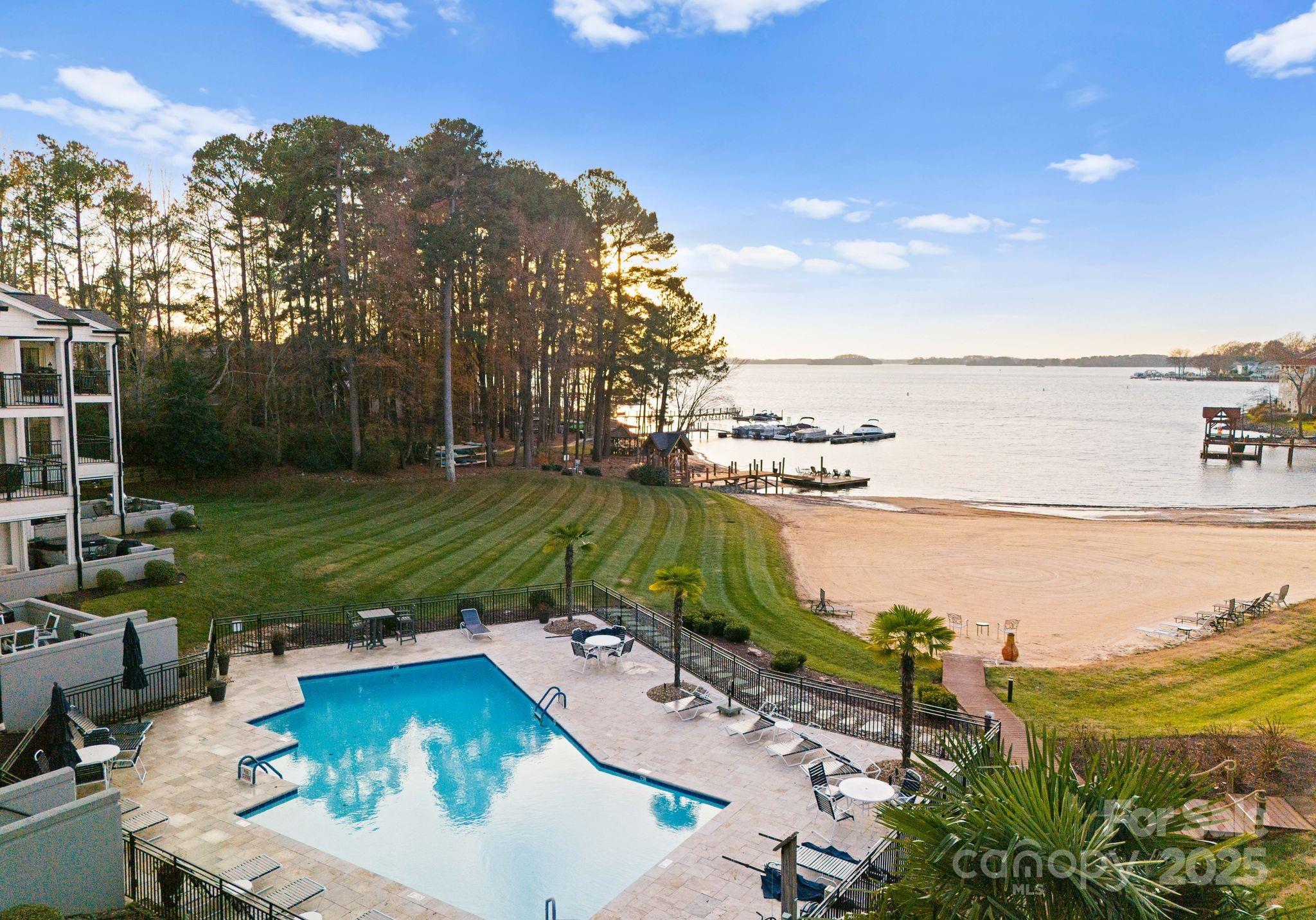17811 Half Moon Lane, Unit E Cornelius, NC 28031 - Photo 34 of 42 a view of a lake with a yard