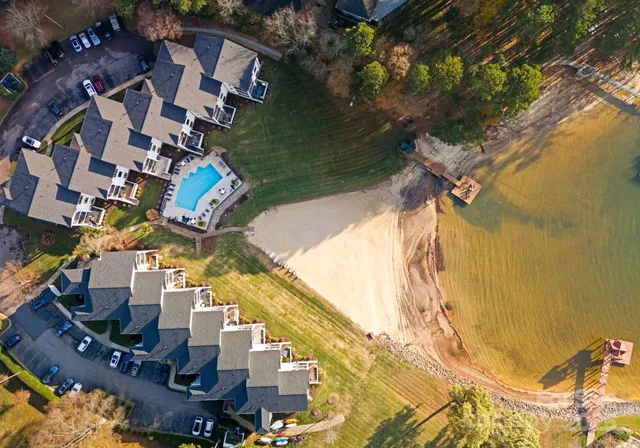 a aerial view of a house with swimming pool and outdoor space