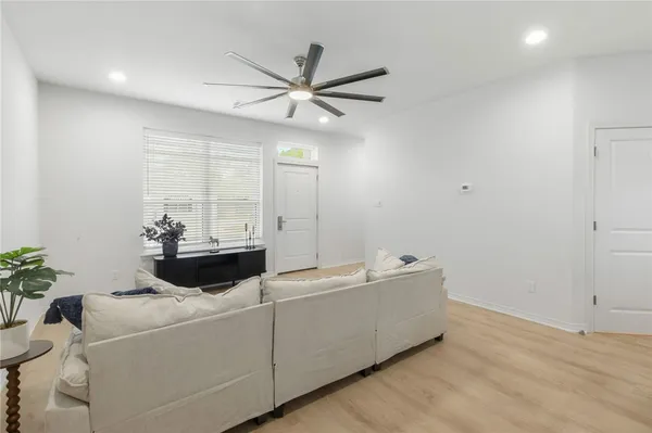 a living room with furniture and window