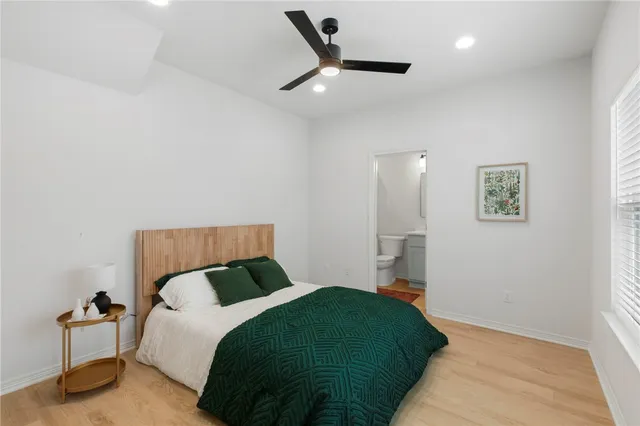 a bedroom with a bed and a walk in closet