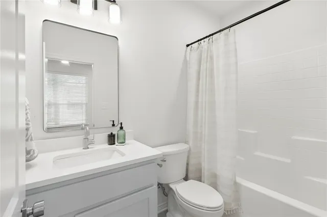 a bathroom with a sink toilet and bathtub