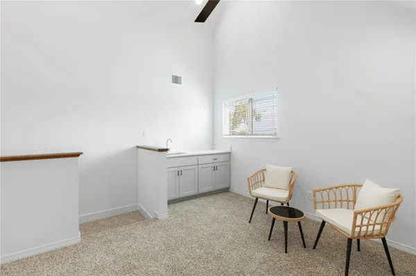a work room with a window and furniture