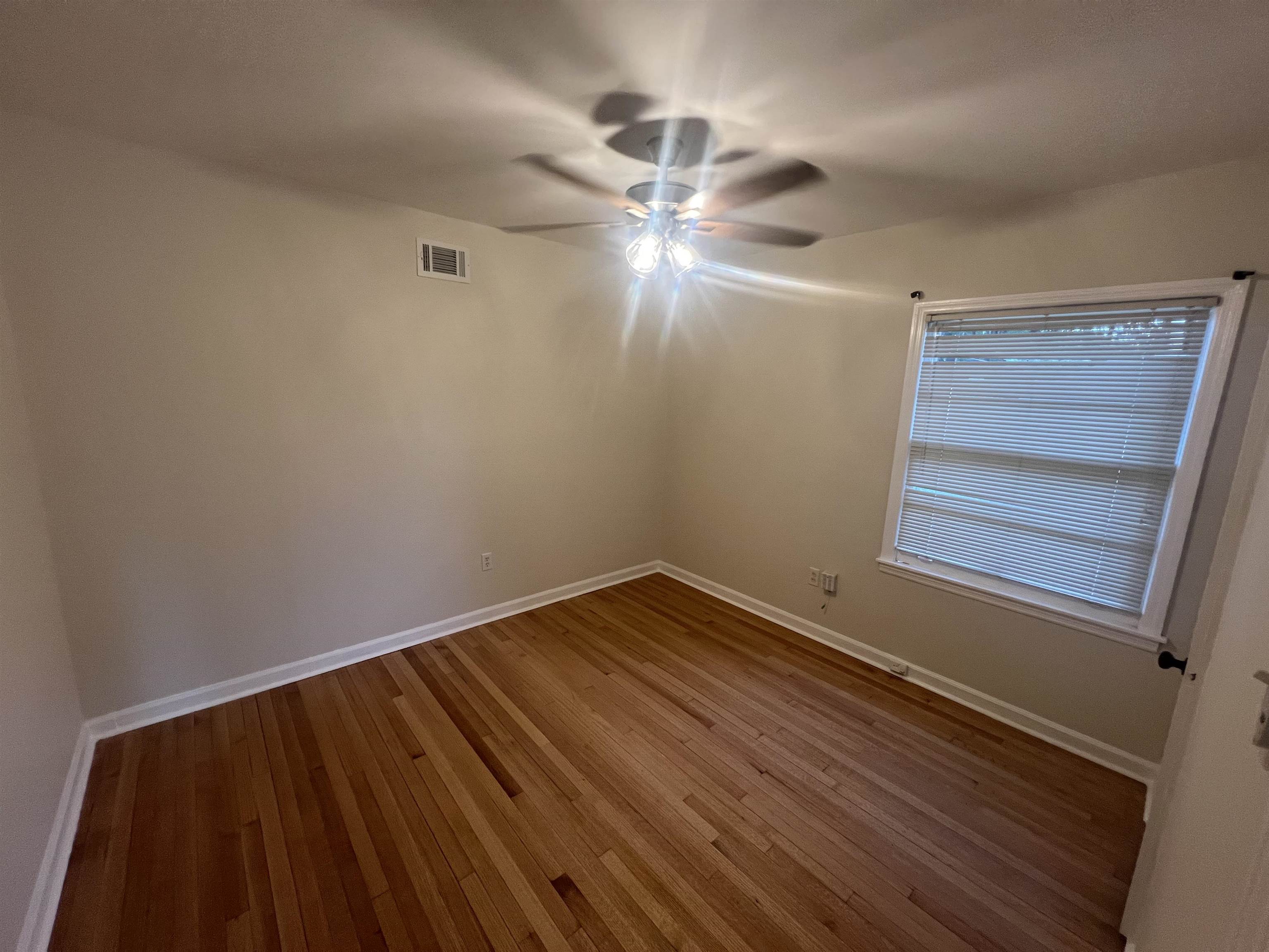 5131 Verne Road Memphis, TN 38117 - Photo 12 of 35 Spare room with ceiling fan and wood-type flooring