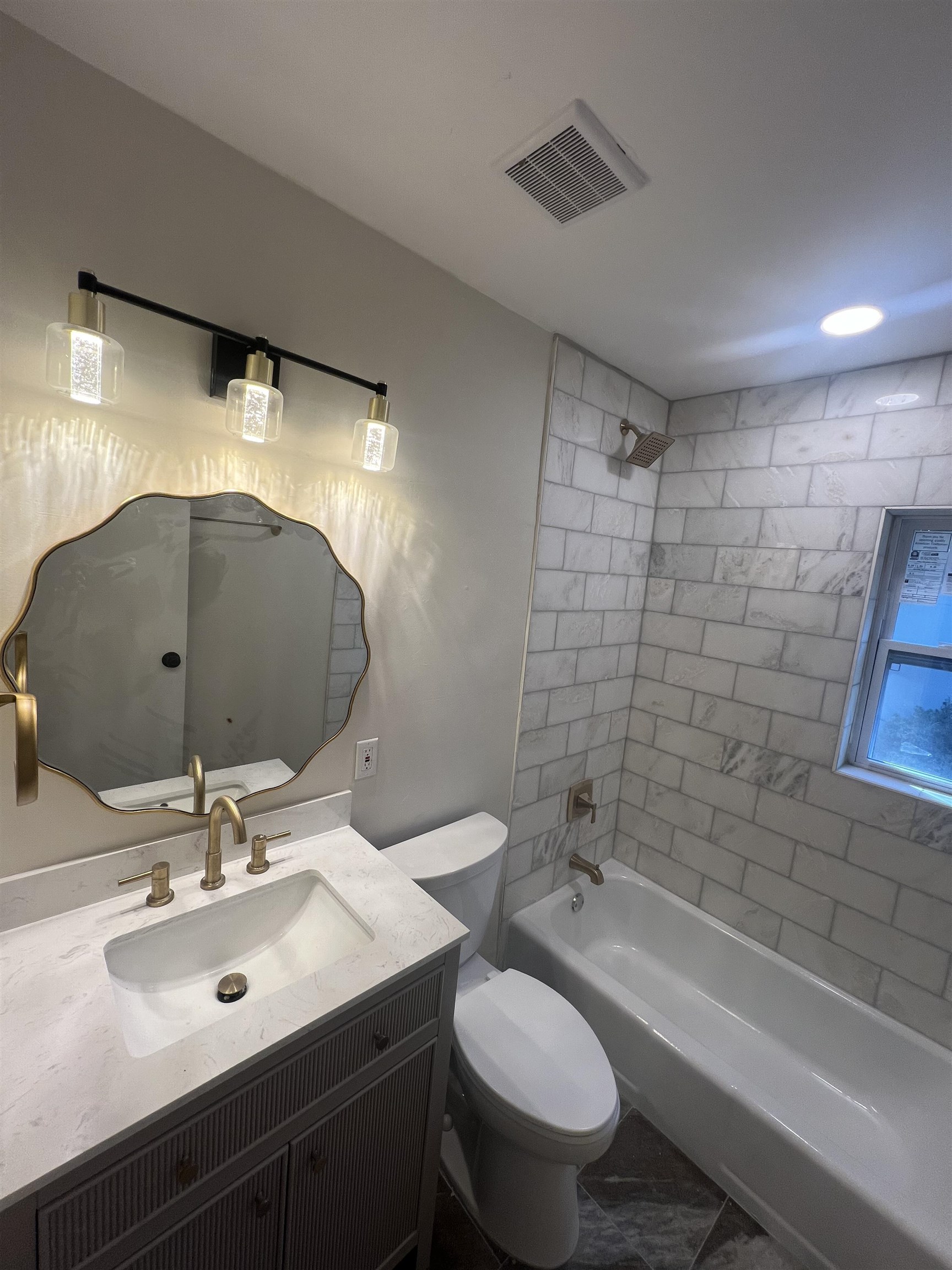 5131 Verne Road Memphis, TN 38117 - Photo 15 of 35 Full bathroom featuring vanity, toilet, tile patterned floors, and tiled shower / bath