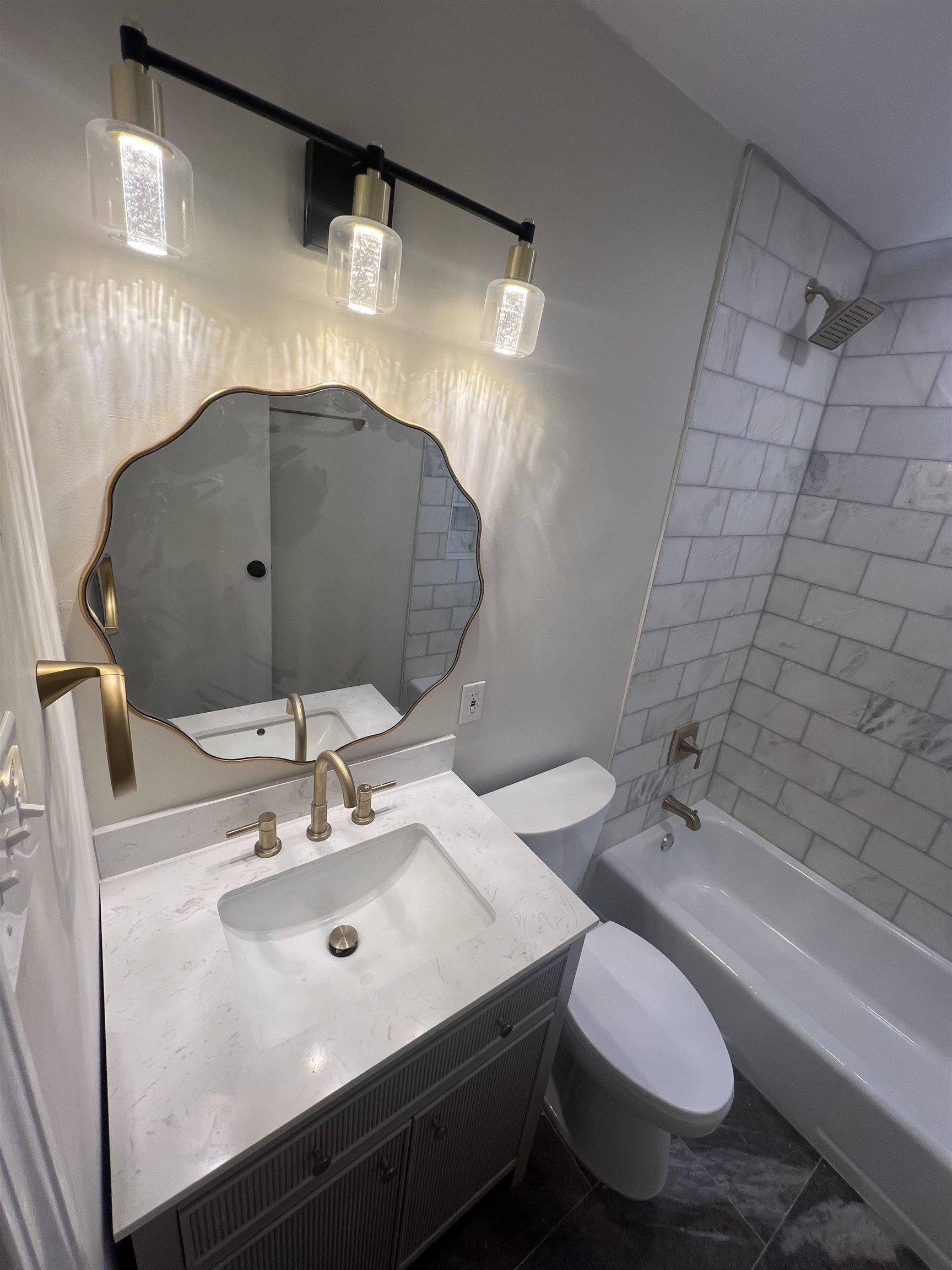 5131 Verne Road Memphis, TN 38117 - Photo 17 of 35 Full bathroom featuring tiled shower / bath, vanity, toilet, and tile patterned floors