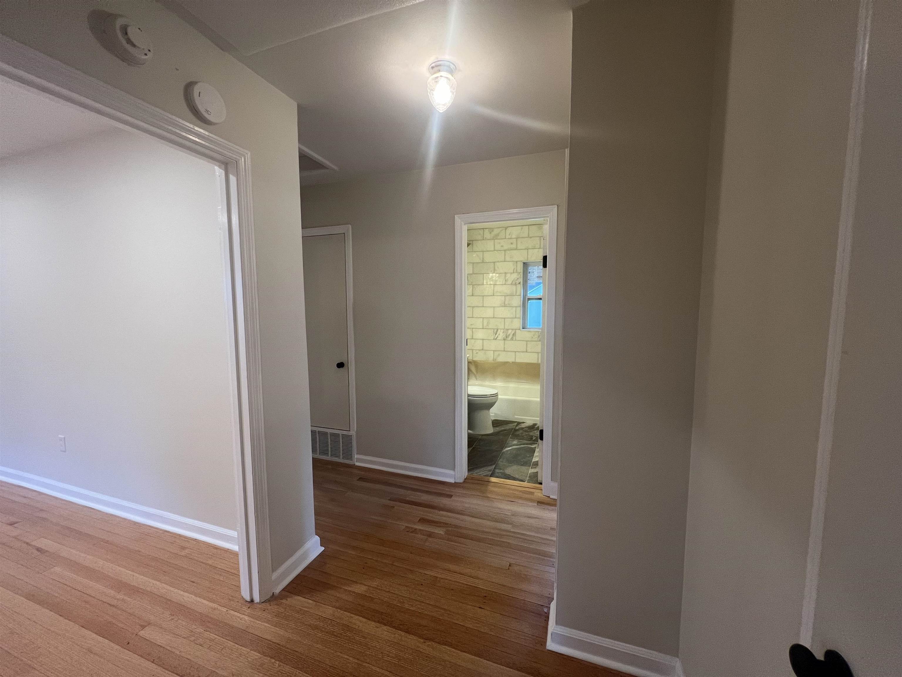 5131 Verne Road Memphis, TN 38117 - Photo 21 of 35 Corridor featuring hardwood / wood-style flooring