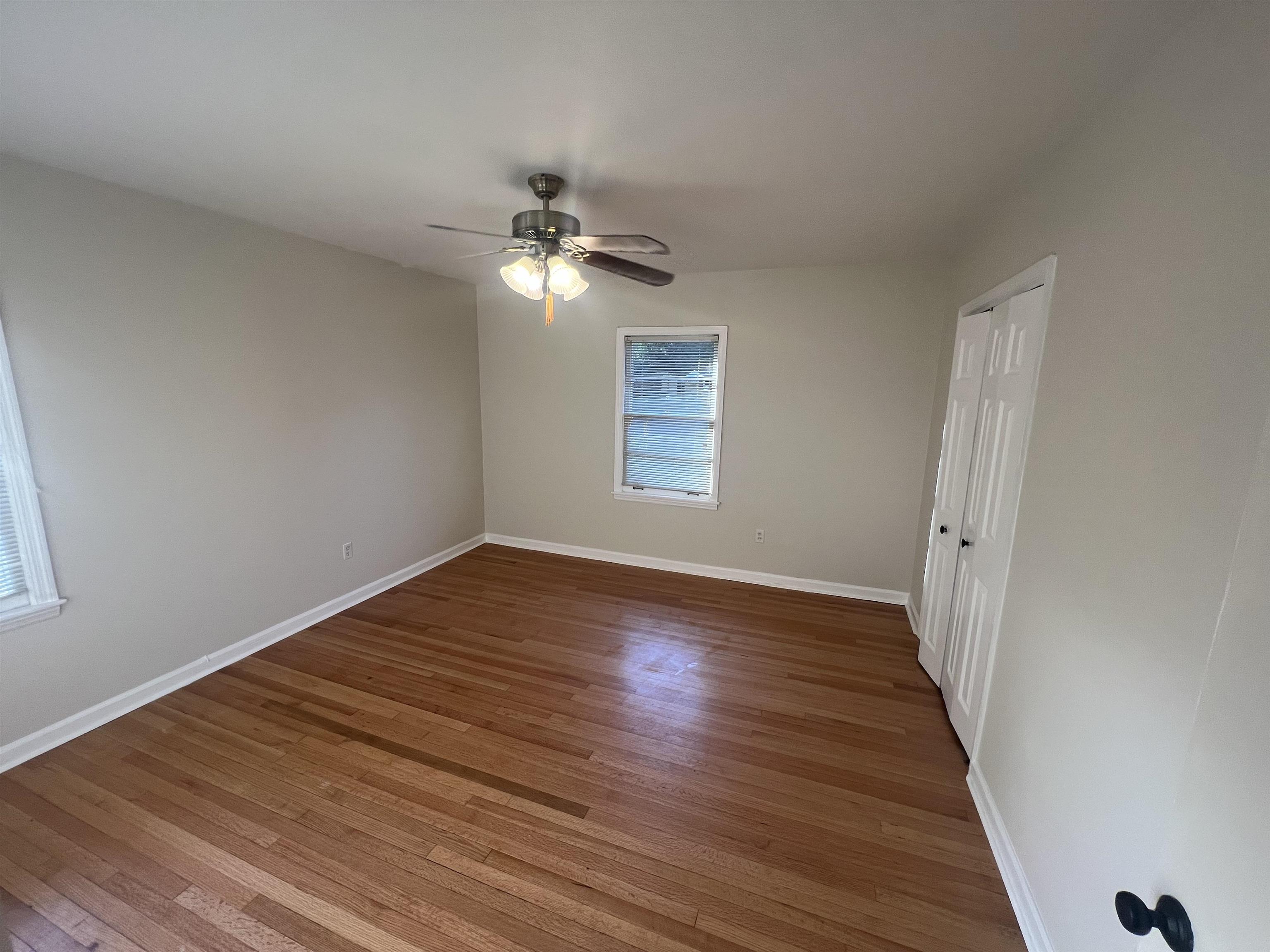 5131 Verne Road Memphis, TN 38117 - Photo 22 of 35 Spare room featuring a wealth of natural light, ceiling fan, and wood-type flooring
