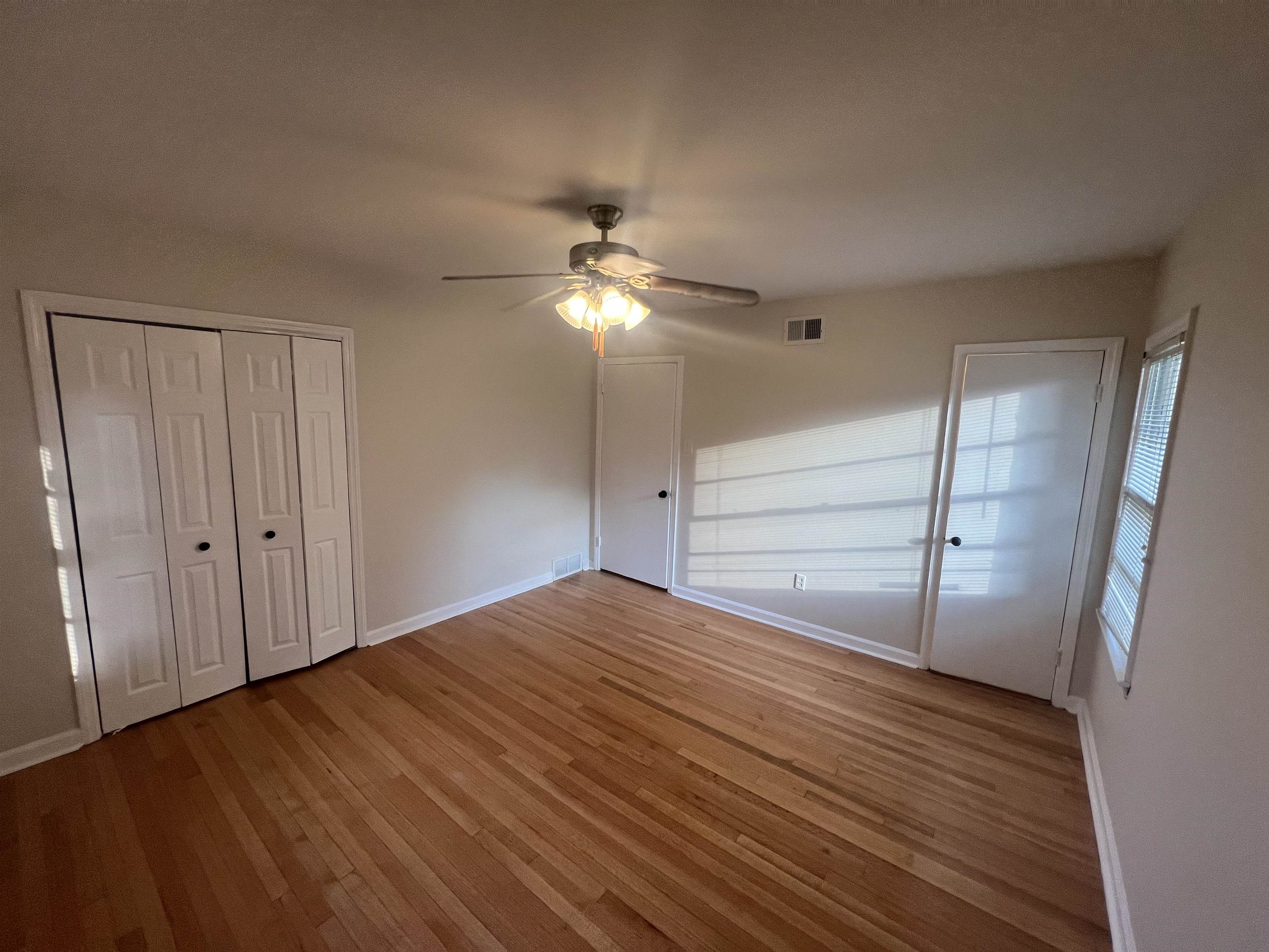 5131 Verne Road Memphis, TN 38117 - Photo 24 of 35 Unfurnished bedroom featuring light wood-type flooring, ceiling fan, and a closet