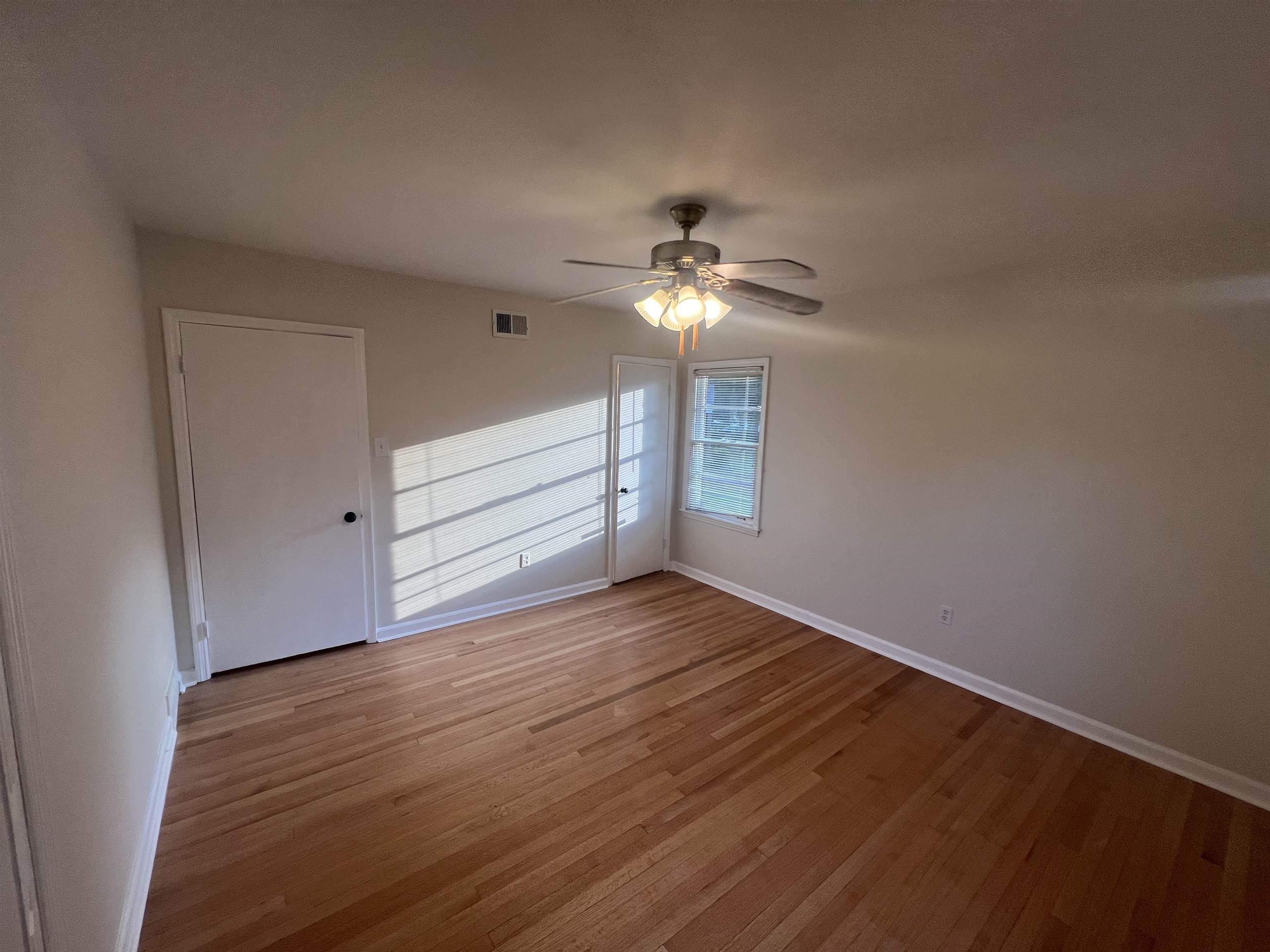 5131 Verne Road Memphis, TN 38117 - Photo 25 of 35 Unfurnished room with ceiling fan and hardwood / wood-style flooring