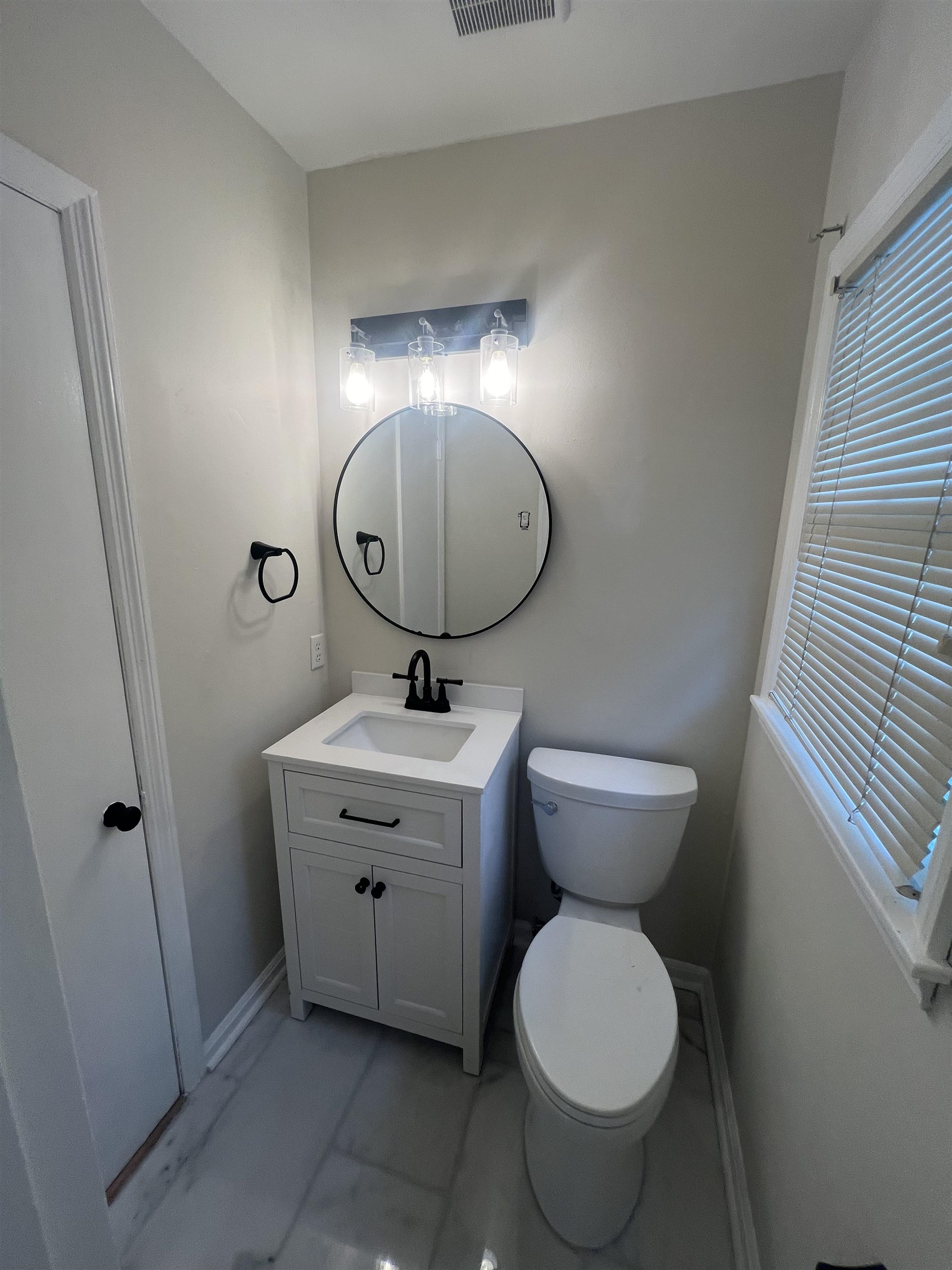 5131 Verne Road Memphis, TN 38117 - Photo 26 of 35 Bathroom with tile patterned floors, vanity, and toilet