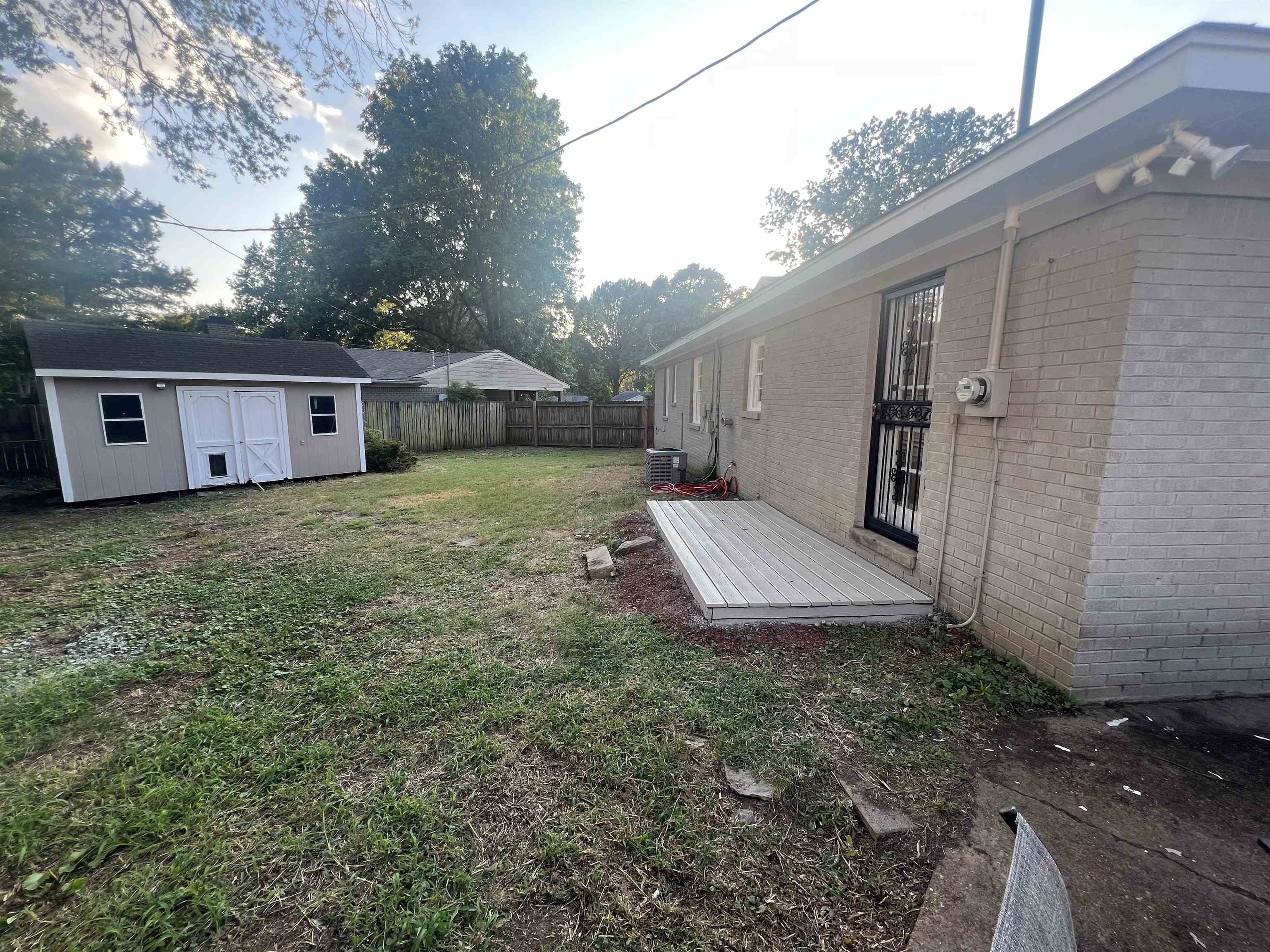 5131 Verne Road Memphis, TN 38117 - Photo 29 of 35 View of yard featuring central AC and a shed