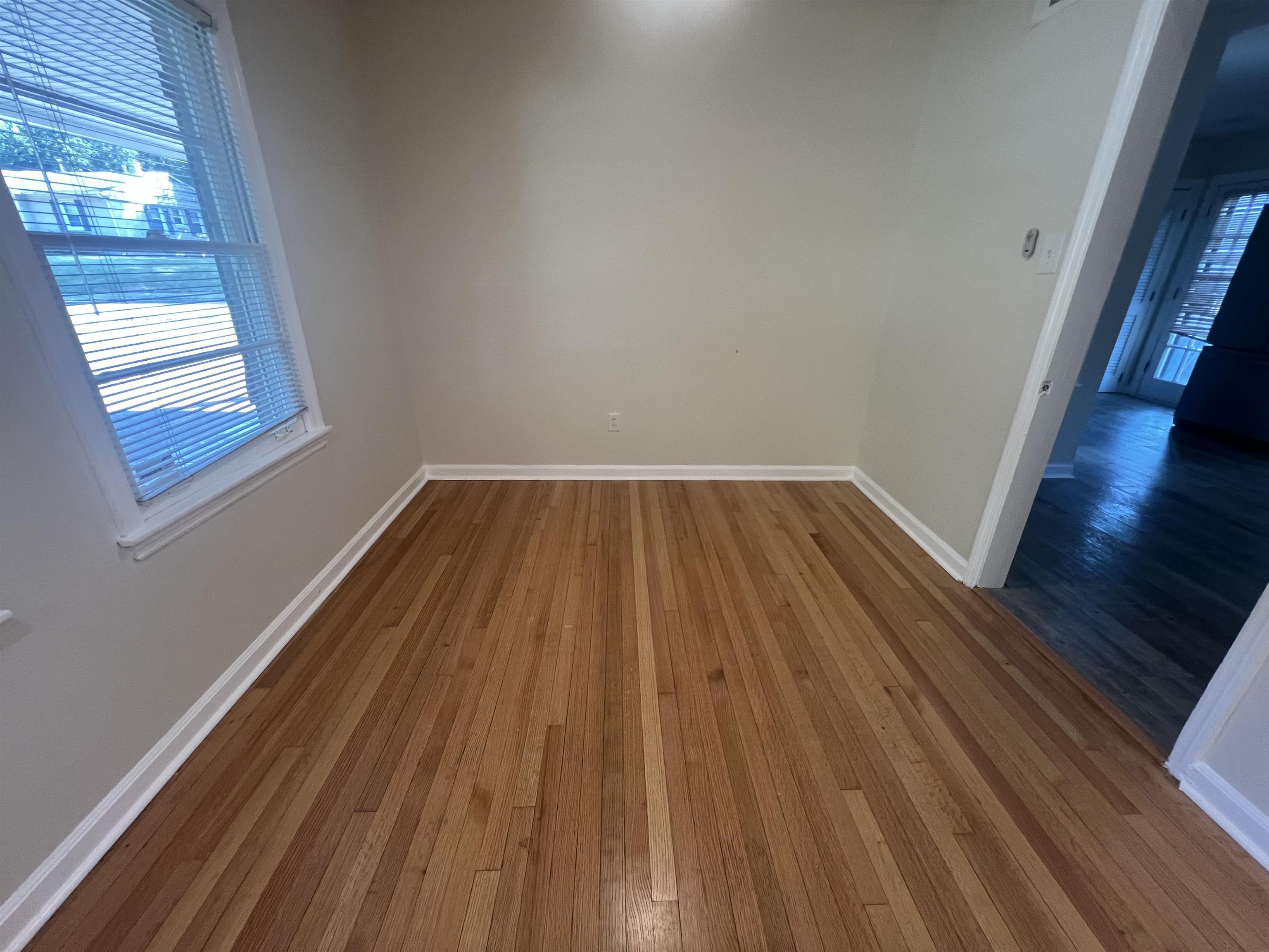 5131 Verne Road Memphis, TN 38117 - Photo 9 of 35 Unfurnished room with hardwood / wood-style floors