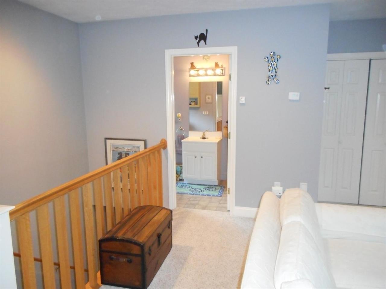 83 Norris Road Sagamore Beach, MA 02562 - Photo 8 of 16 a view of bedroom with furniture and wooden floor