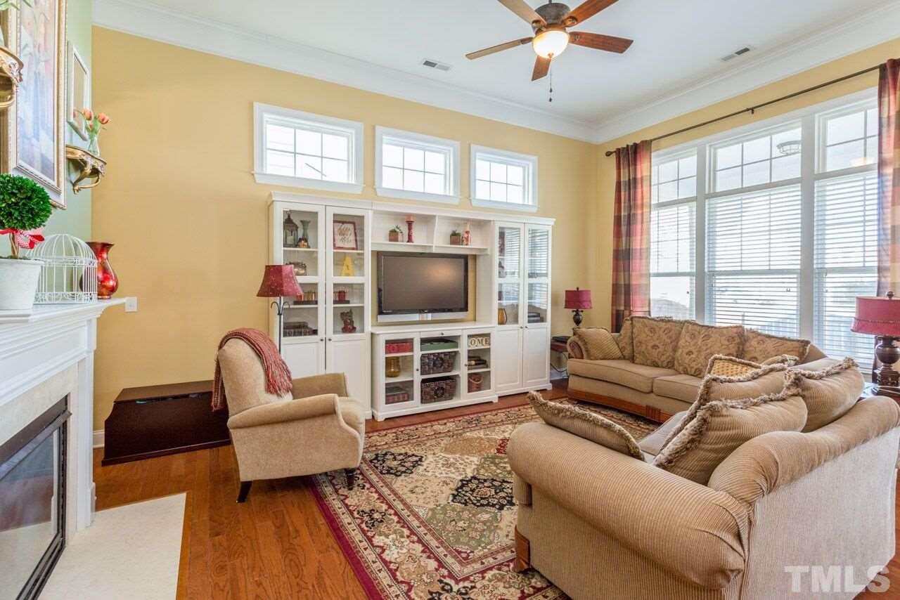 1217 Chapanoke Road Raleigh, NC 27603 - Photo 14 of 25 a living room with furniture and a flat screen tv