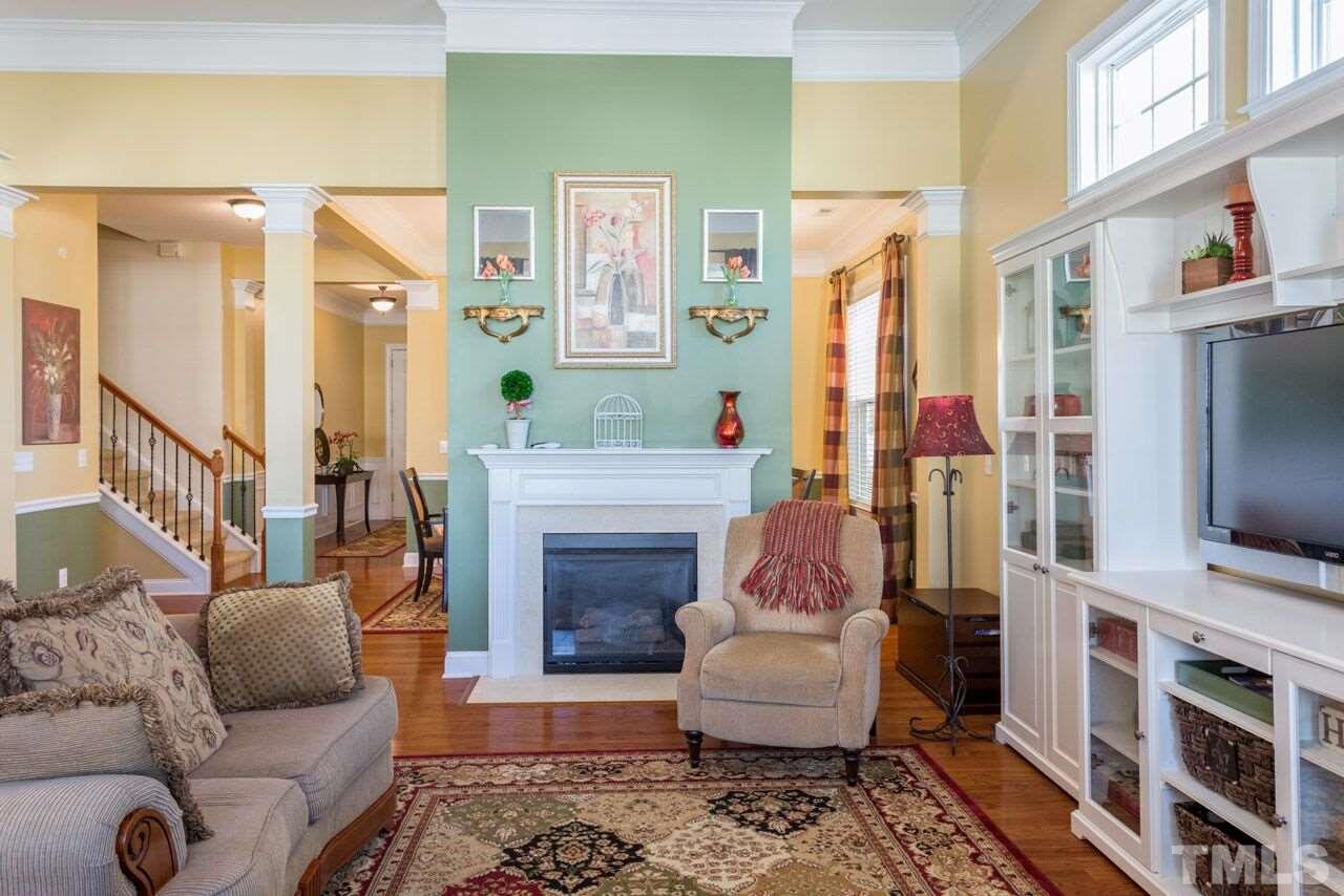 1217 Chapanoke Road Raleigh, NC 27603 - Photo 15 of 25 a living room with furniture and a flat screen tv