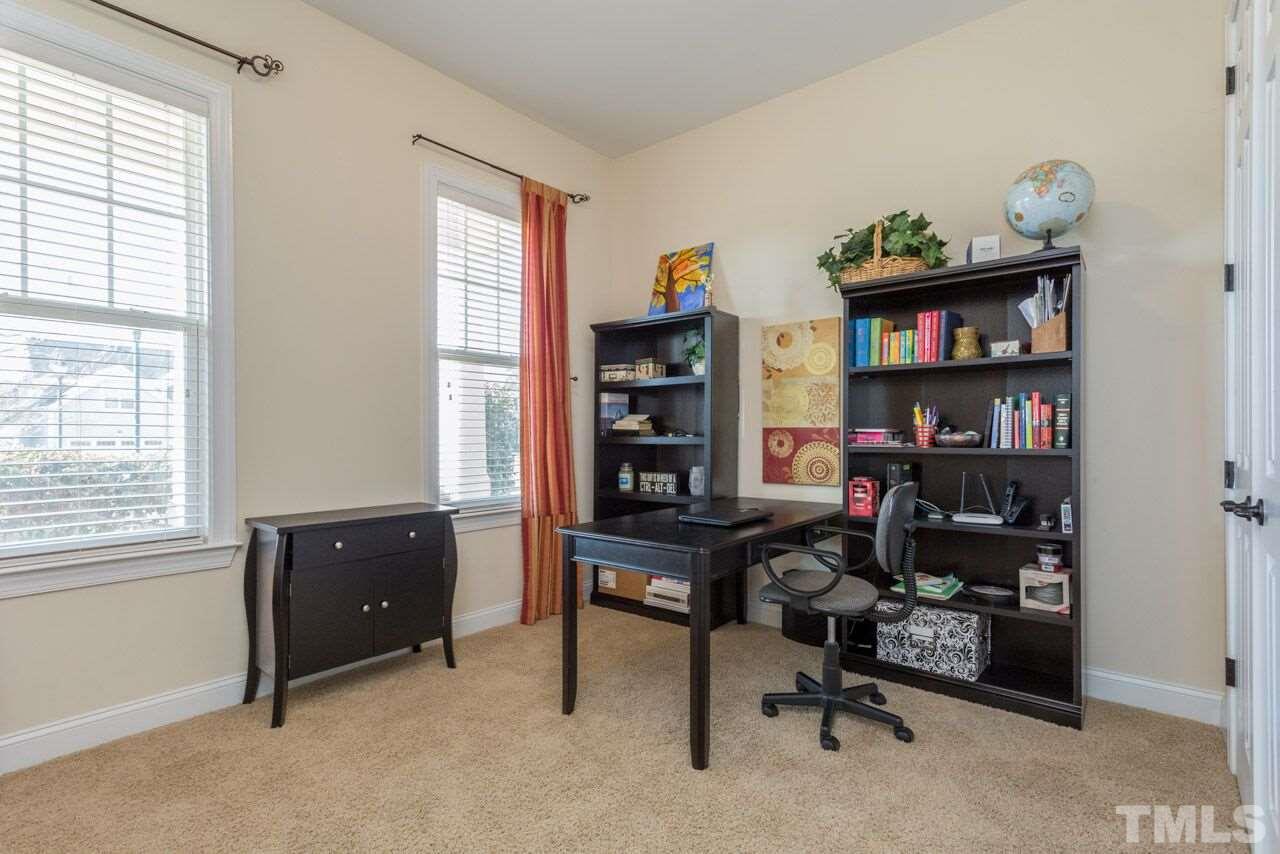 1217 Chapanoke Road Raleigh, NC 27603 - Photo 8 of 25 a view of a workspace with a window and cabinet