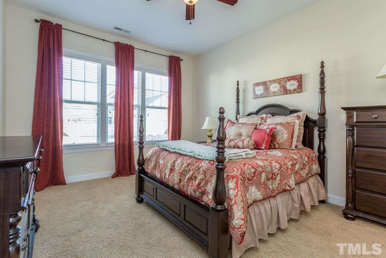 1217 Chapanoke Road Raleigh, NC 27603 - Photo 10 of 25 a bedroom with a bed and a window