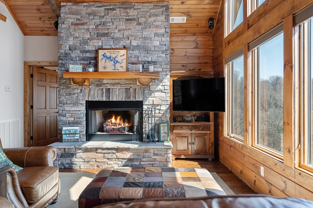 5320 Coconut Ridge Road Smithville, TN 37166 - Photo 11 of 47 a living room with furniture a flat screen tv and a fireplace