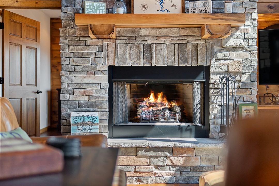 5320 Coconut Ridge Road Smithville, TN 37166 - Photo 13 of 47 a fireplace with a clock on top of it