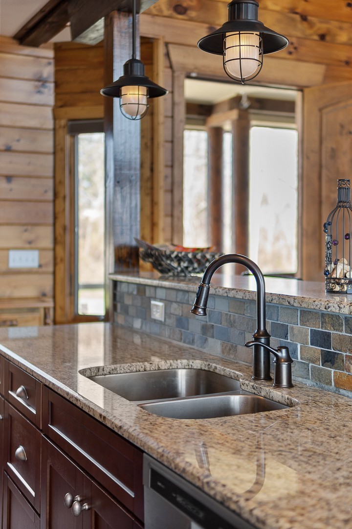 5320 Coconut Ridge Road Smithville, TN 37166 - Photo 19 of 47 a kitchen with a sink a counter appliances and cabinets