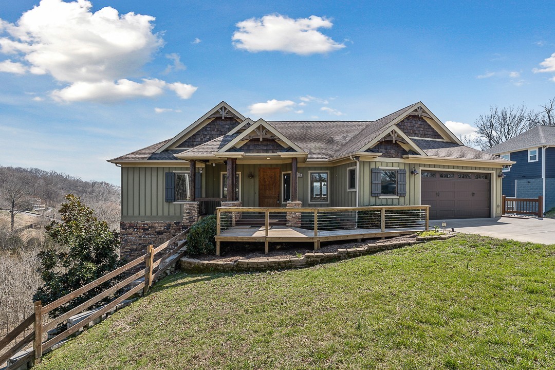 5320 Coconut Ridge Road Smithville, TN 37166 - Photo 2 of 47 a front view of a house with a garden and yard