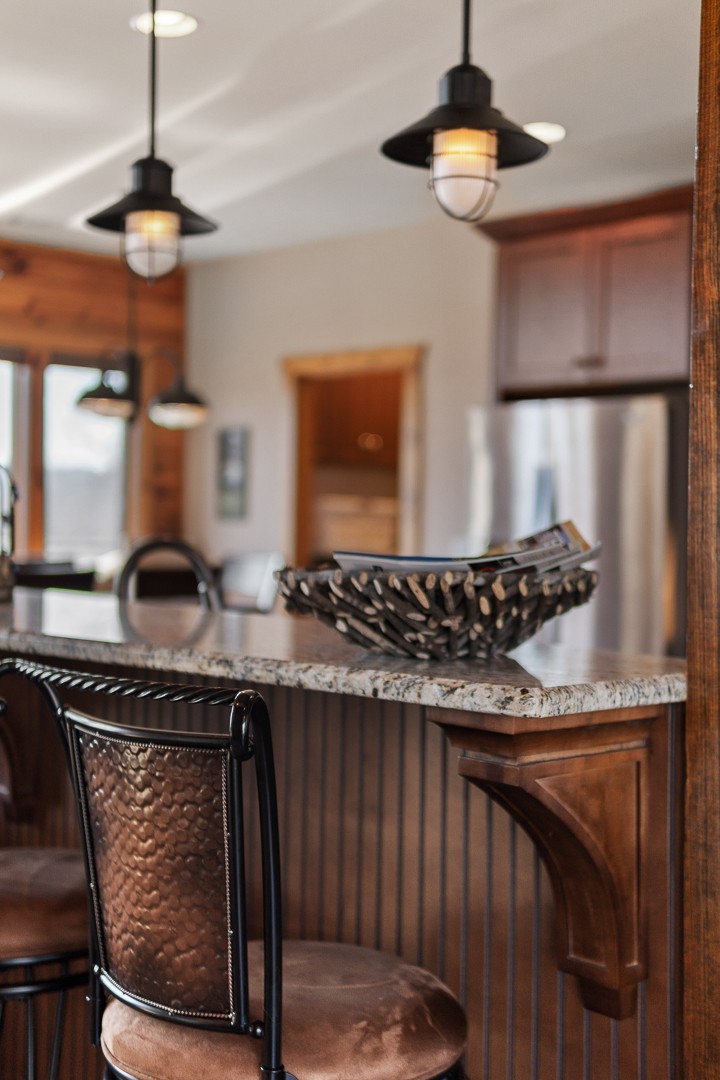 5320 Coconut Ridge Road Smithville, TN 37166 - Photo 21 of 47 a kitchen with a stove a chandelier and wooden floor