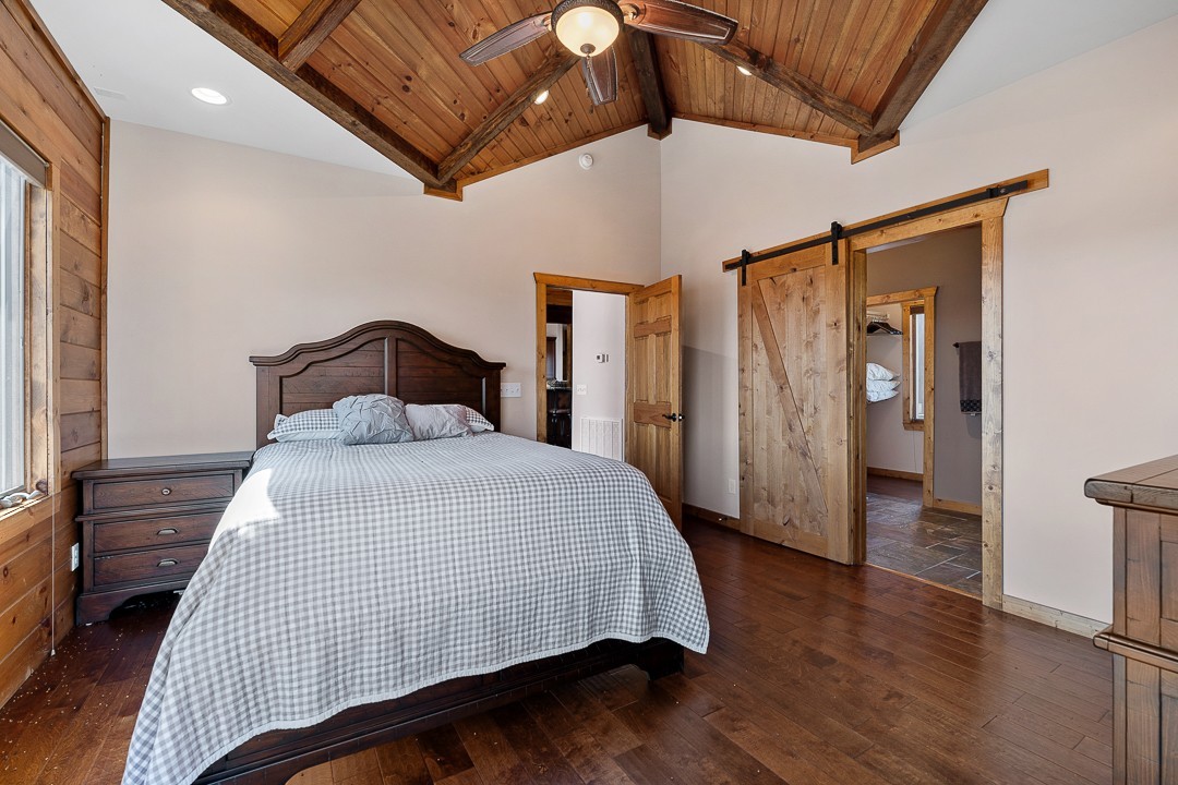 5320 Coconut Ridge Road Smithville, TN 37166 - Photo 23 of 47 a bedroom with a bed and wooden floor