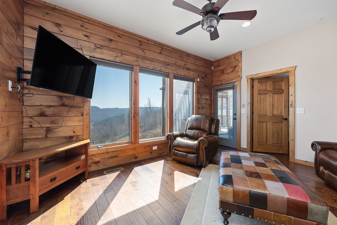 5320 Coconut Ridge Road Smithville, TN 37166 - Photo 32 of 47 a bedroom with furniture and a flat screen tv