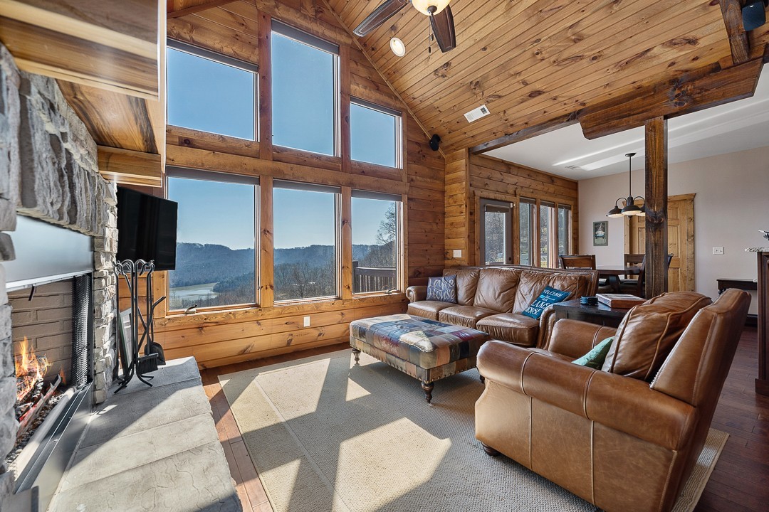 5320 Coconut Ridge Road Smithville, TN 37166 - Photo 8 of 47 a living room with furniture and a floor to ceiling window