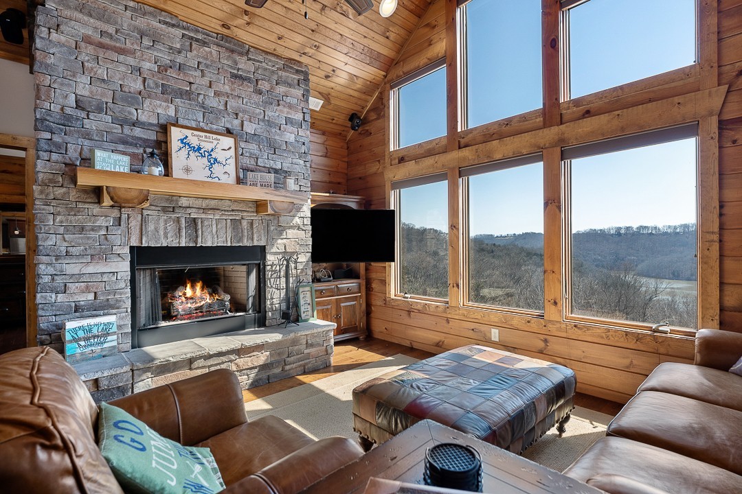 5320 Coconut Ridge Road Smithville, TN 37166 - Photo 9 of 47 a living room with furniture fireplace and a large window