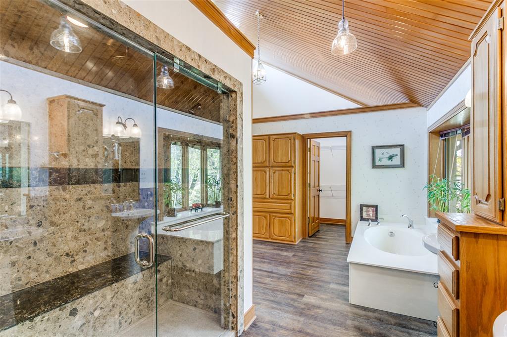 1557 Latigo Hills Road Bartonville, TX 75022 - Photo 19 of 40 Bathroom with a vaulted wood ceiling, a bath, a shower stall, dark wood-type flooring, and crown molding